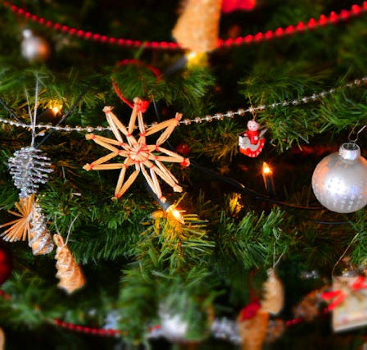 Festively decorated Christmas tree with colorful lights and ornaments, representing the holiday spirit for the upcoming Christmas celebration event.